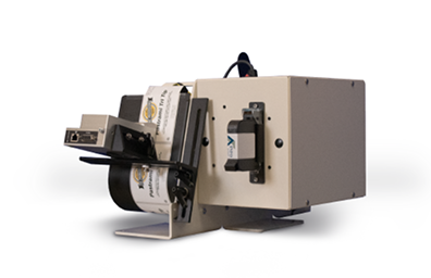 Industrial label printer with a roll of labels feeding through the printer head.