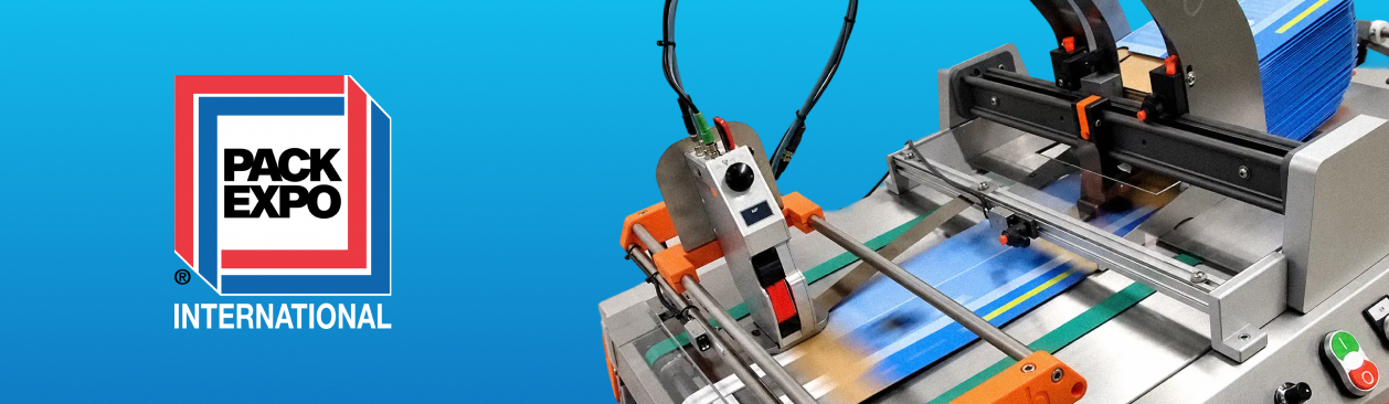 PACK EXPO International logo alongside an automated industrial feeding and coding machine for packaging production.