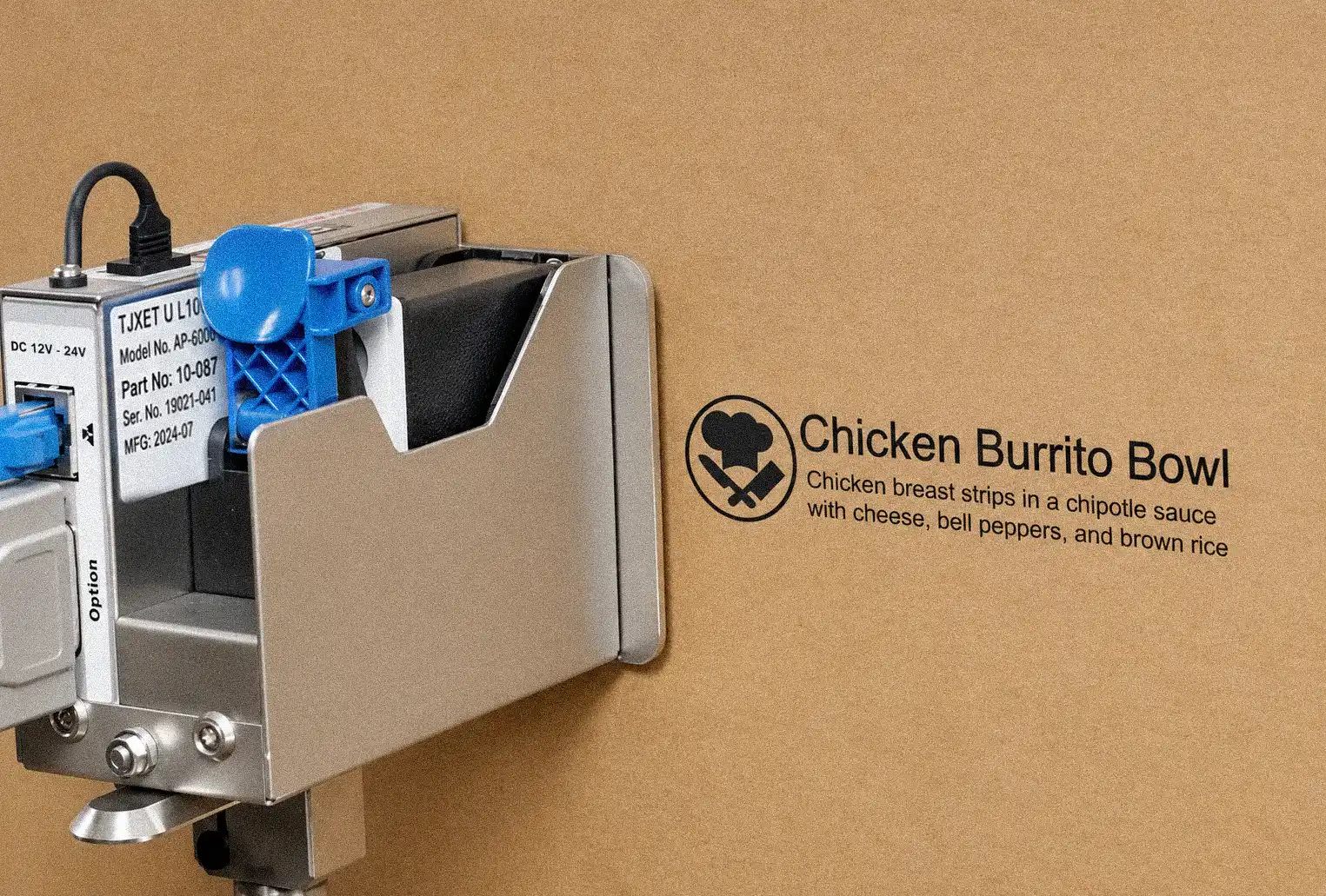 Thermal inkjet printer applying product information to a corrugated cardboard box for Chicken Burrito Bowl packaging.